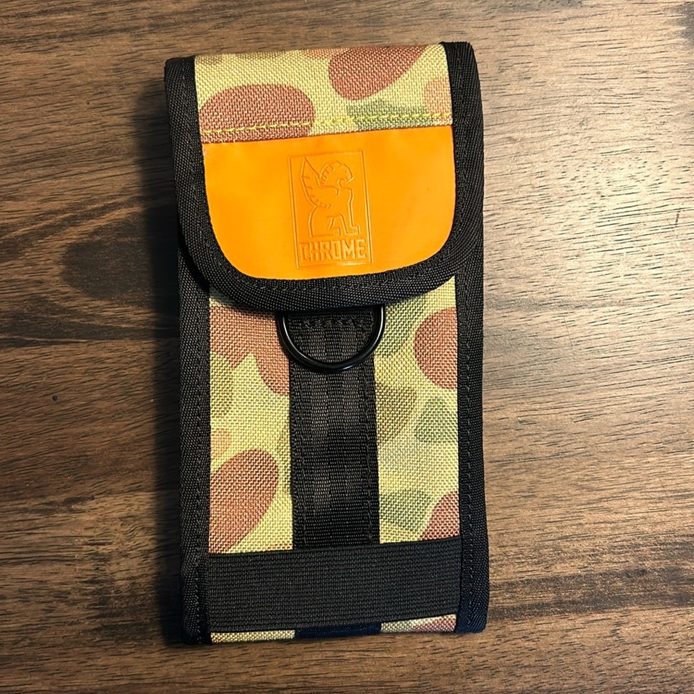 Chrome cell phone case attachment.  Compatible with iPhone XL/wallets.